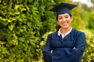 Someone wearing a graduation gown